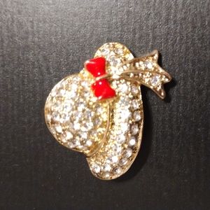 Gold toned Hat Brooch with clear rhinestones and a red bow